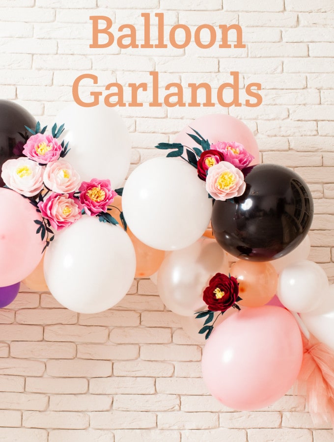 pretty pink and orange Balloon Garland with flowers