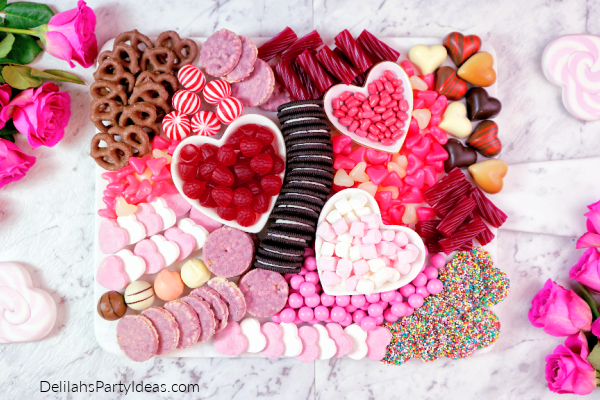 Charcuterie Board full of pink and red candy