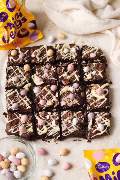Gooey Easter Brownies with gooey eggs on top and around the brownie on the plate
