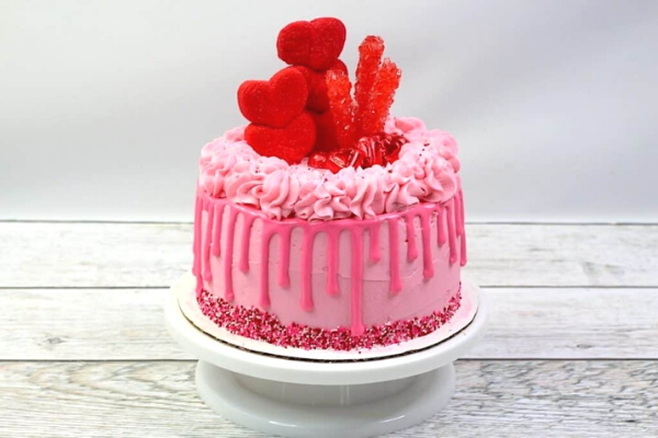 Beautiful Pink Love Cake with red hearts with pink icing