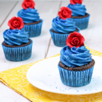 Plate with Beauty and the Beast Cupcake on with other cupcakes around
