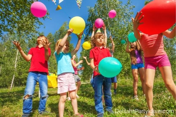 kids playing with Balloons in the garden