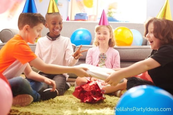 group of children playing pass the parcel at a birthday party