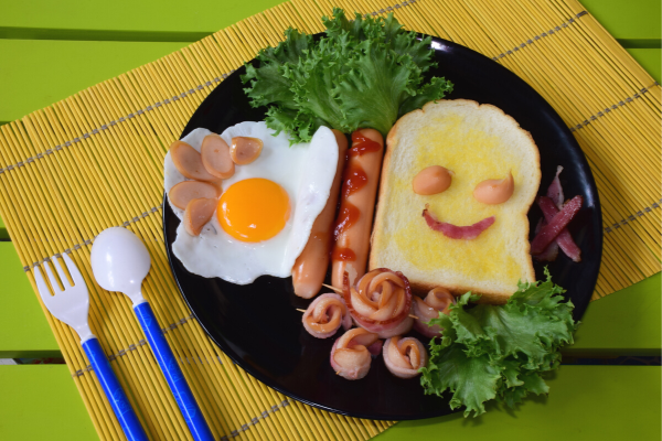 Smiley sausage and eggs for breakfast