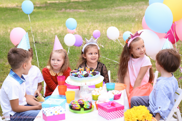 Kids Garden party Ideas, kids sitting around birthday cake