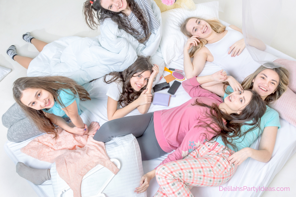 Teenage Sleepover group of girls on the bed