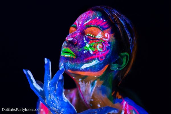 Lady with Glow In The Dark paint all over her face
