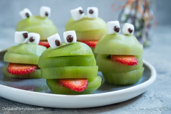 Kiwi fruit sliced into Halloween monsters