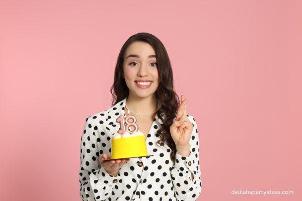 Girl holding 18th birthday cake