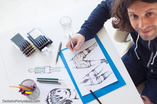 Male artist painting manga art