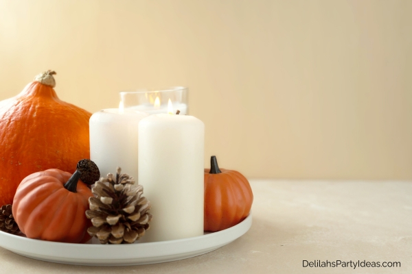 Fall centerpiece of pumpkins and candles