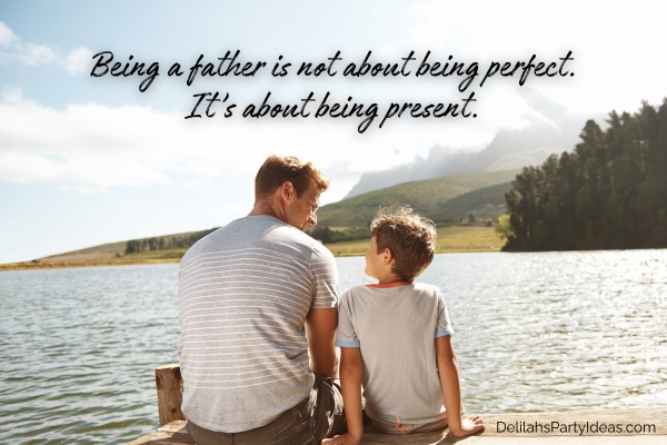 Father and son sitting on pier by the lake