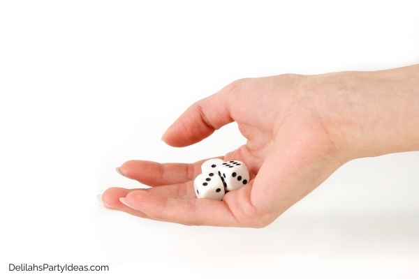 hand about to roll 3 dice