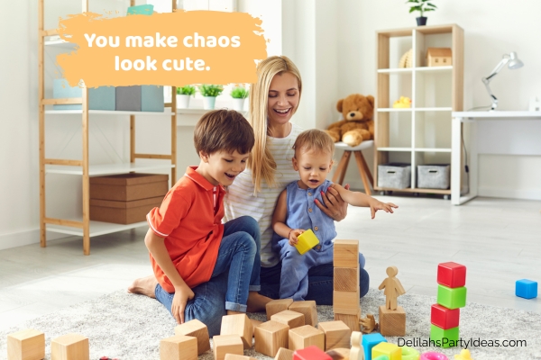 Mom playing with 2 kids, blocks scattered on the floor, with quote overlay