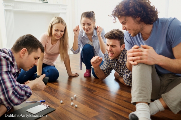 Group of friends playing a game with dice