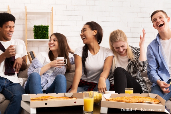 Teens having fun at a party at home