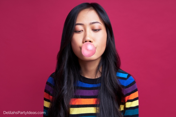 Woman blowing bubble using gum