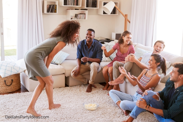 Group of friends sitting on a couch laughing