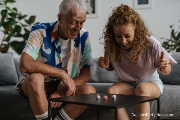 Father and daughter playing dice game