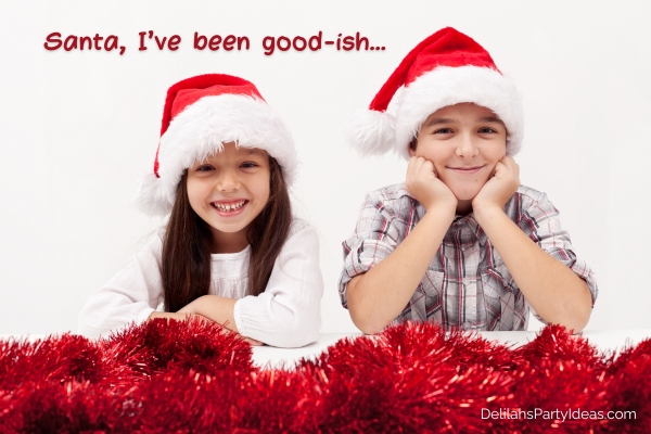 Smiling girl and boy wearing Santa hats, with quote overlay