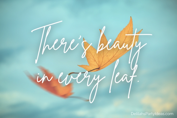 Falling autumn leaves with blue sky background, with quote overlay