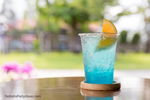 Blue mocktail garnished with lemon slice