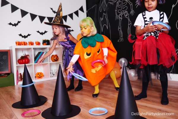 kids playing witch hat ring toss