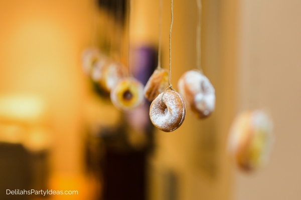 Mini donuts hung from strings