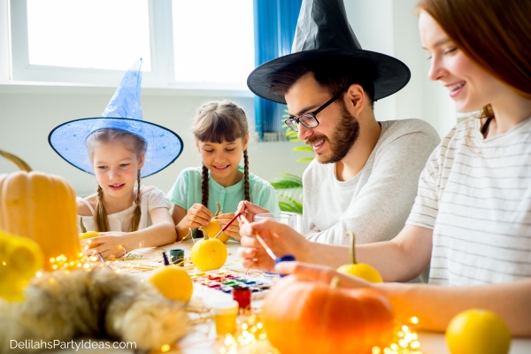 Family decorating pumpkins
