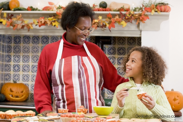 grandmother and granddaughter making halloween treats