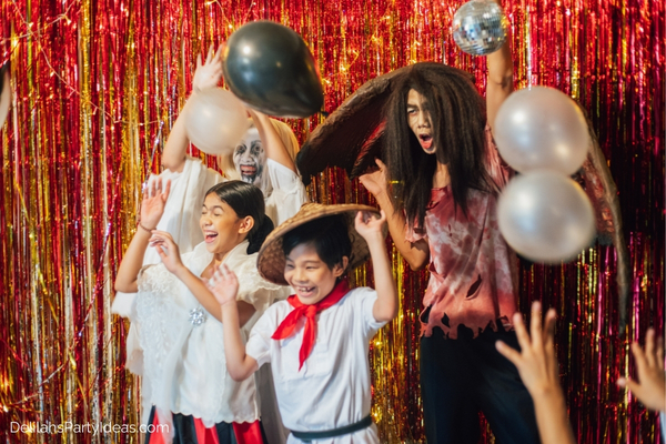 family in costume at Halloween party