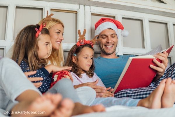 family reading a book on Christmas