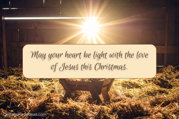 Light shining on nativity manger, with Christmas wish overlay
