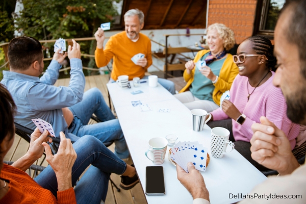 group of 6 friends playing a card game