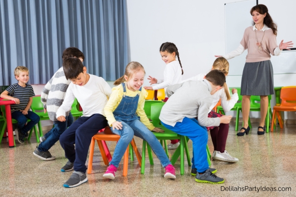 kids in a classroom playing musical chairs