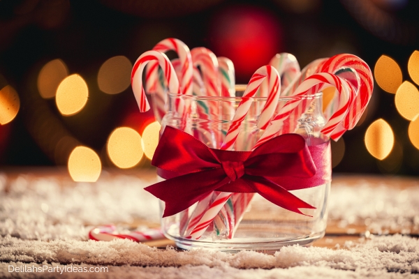 candy canes on a glass jar with ribbon