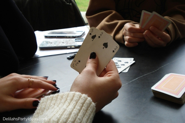 2 persons playing a card game