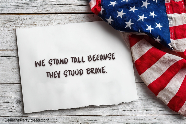 American flag on wooden table with quote on paper