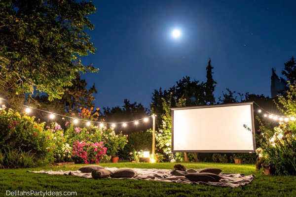 backyard movie night setup with lights