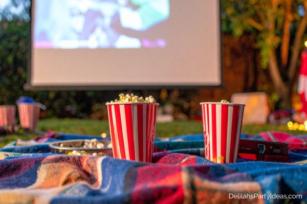 popcorn on blanket for a backyard movie setup