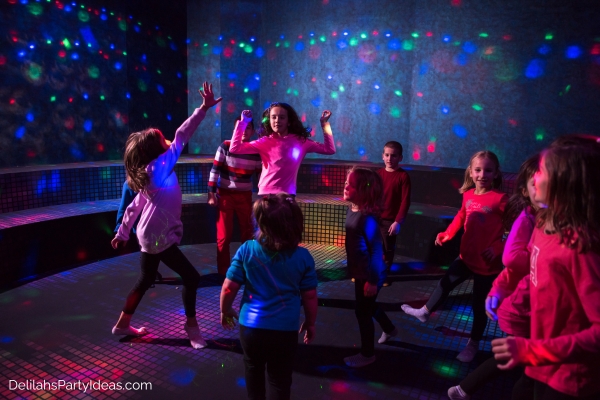 kids dancing in a neon disco party