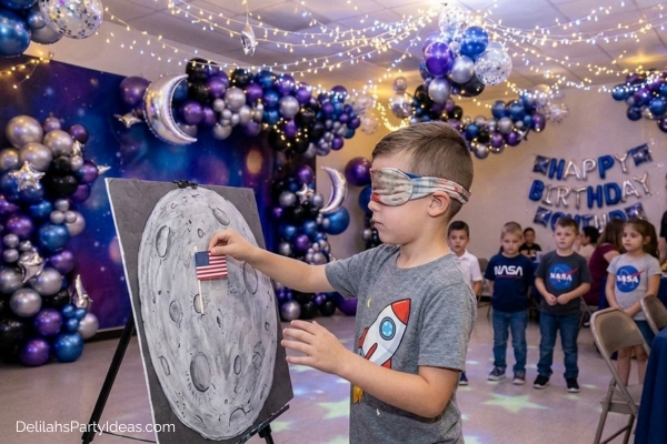 kids playing pin the flag on the moon game