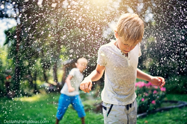 water balloon fight between 2 boys