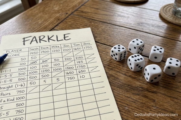6 dice and a farkle scoresheet on a wooden table