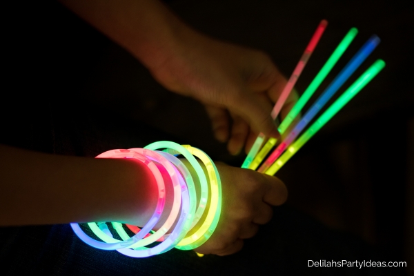 Person holding glow sticks