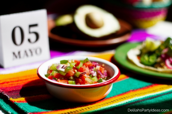 bowl of salsa, plate of tacos