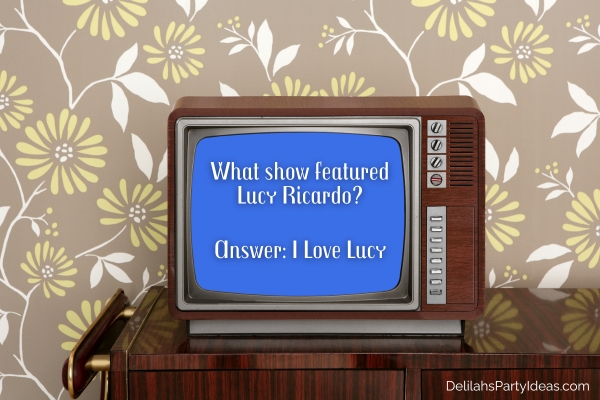 Retro wooden TV from, floral wallpaper, with trivia question and answer overlay