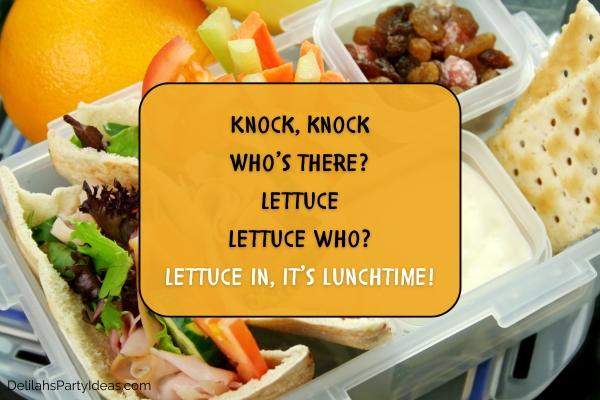 kid's lunchbox containing pita bread ham and salad, crackers, fruits, with joke overlay