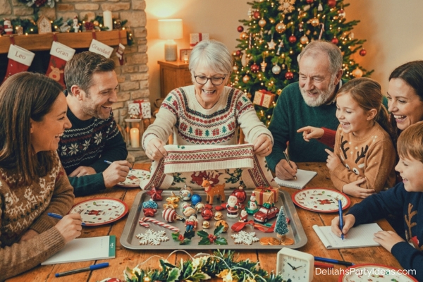 tray full of various Christmas trinkets while family looks to play Christmas Memory game