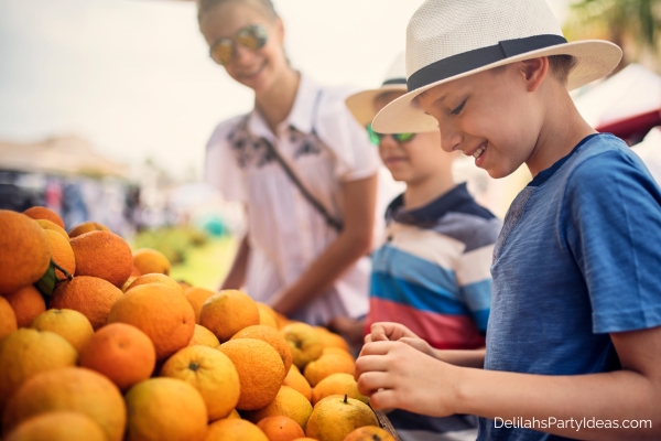 mother with kids at the farmers market